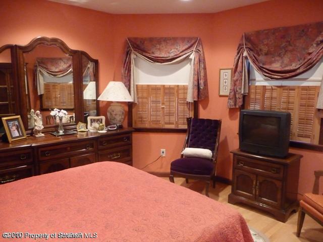 214 Willow Road Pittston, PA 18640 - Photo 16 of 19 a bedroom with furniture and a fireplace