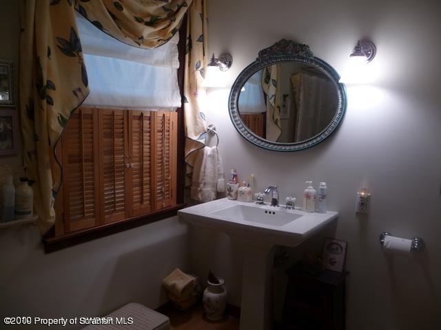 214 Willow Road Pittston, PA 18640 - Photo 17 of 19 a bathroom with a sink and a mirror