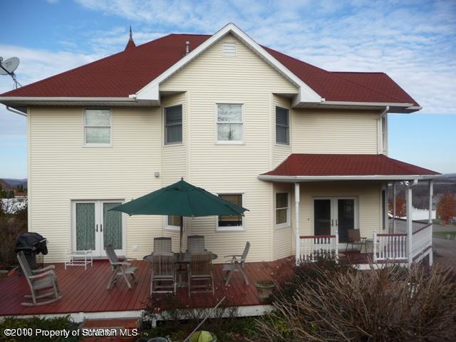 214 Willow Road Pittston, PA 18640 - Photo 19 of 19 a view of a house with table and chairs under an umbrella