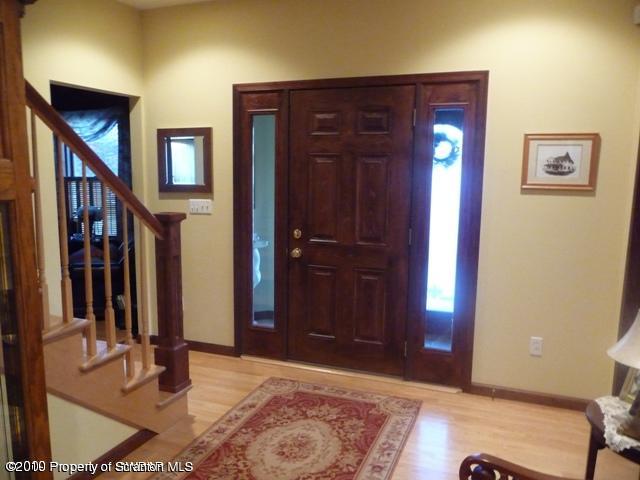 214 Willow Road Pittston, PA 18640 - Photo 2 of 19 a view of a hallway with wooden floor and windows