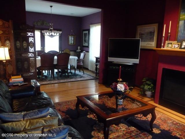 214 Willow Road Pittston, PA 18640 - Photo 4 of 19 a living room with furniture a flat screen tv and a fireplace