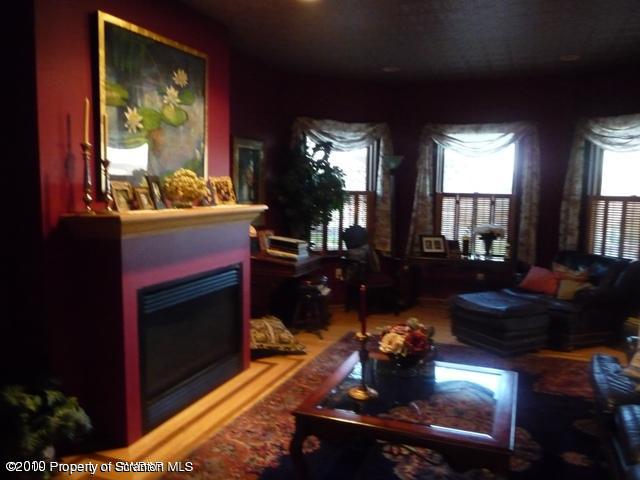 214 Willow Road Pittston, PA 18640 - Photo 5 of 19 a living room with fireplace furniture and a large window