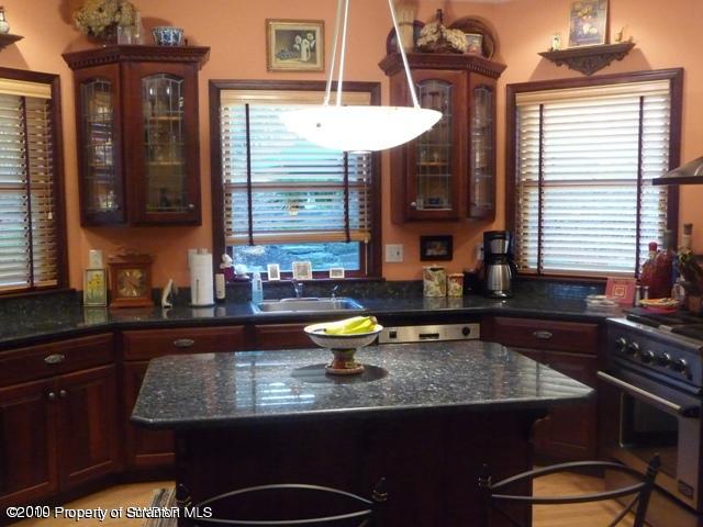 214 Willow Road Pittston, PA 18640 - Photo 8 of 19 a kitchen with a sink a counter space and a window