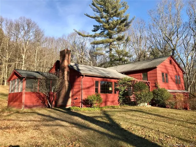a view of a park with iron fence