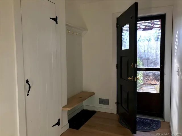 a living room with furniture a fireplace and a table