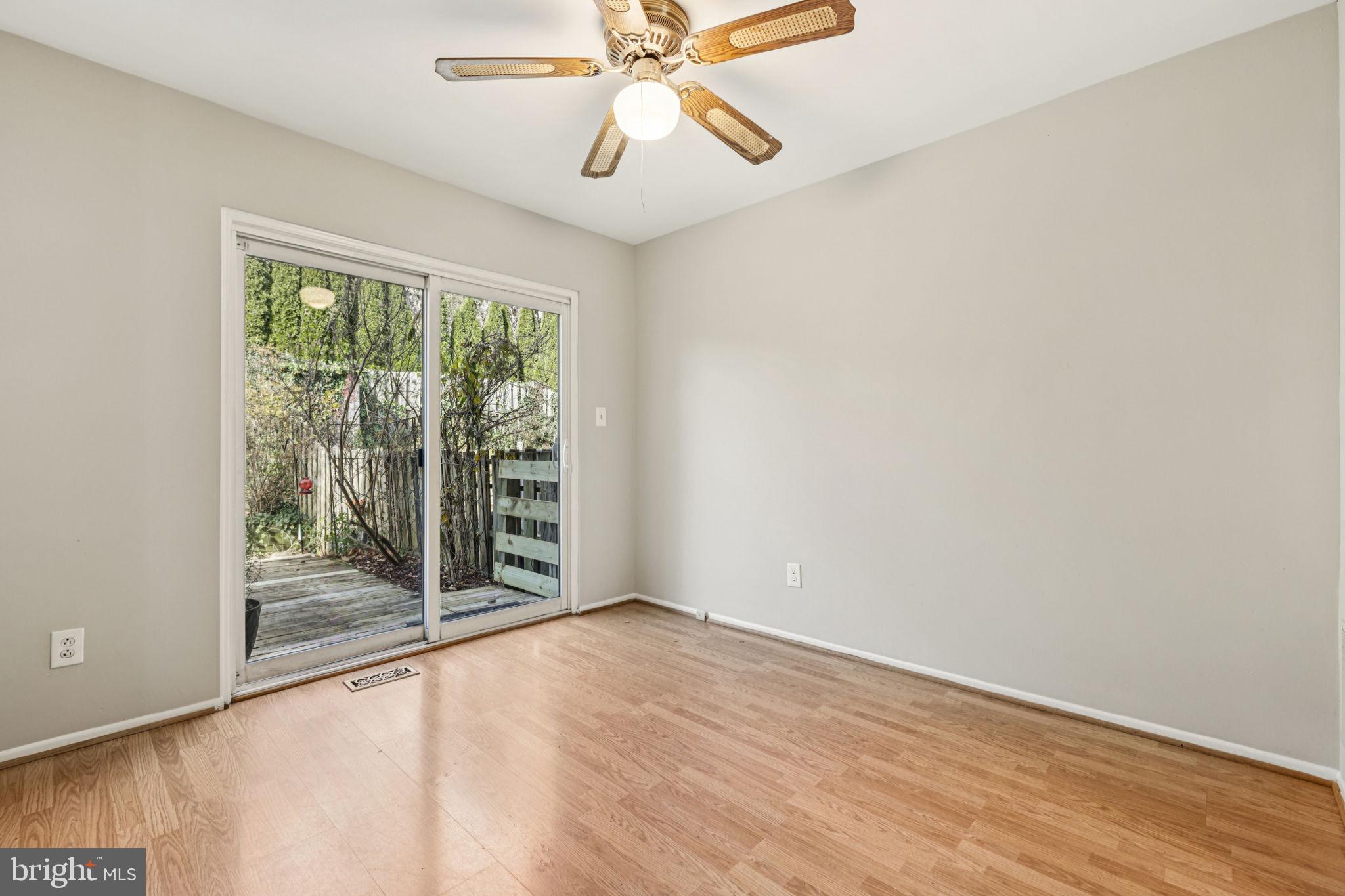 19924 Wyman Way Germantown, MD 20874 - Photo 12 of 47 a view of an empty room with wooden floor and a window