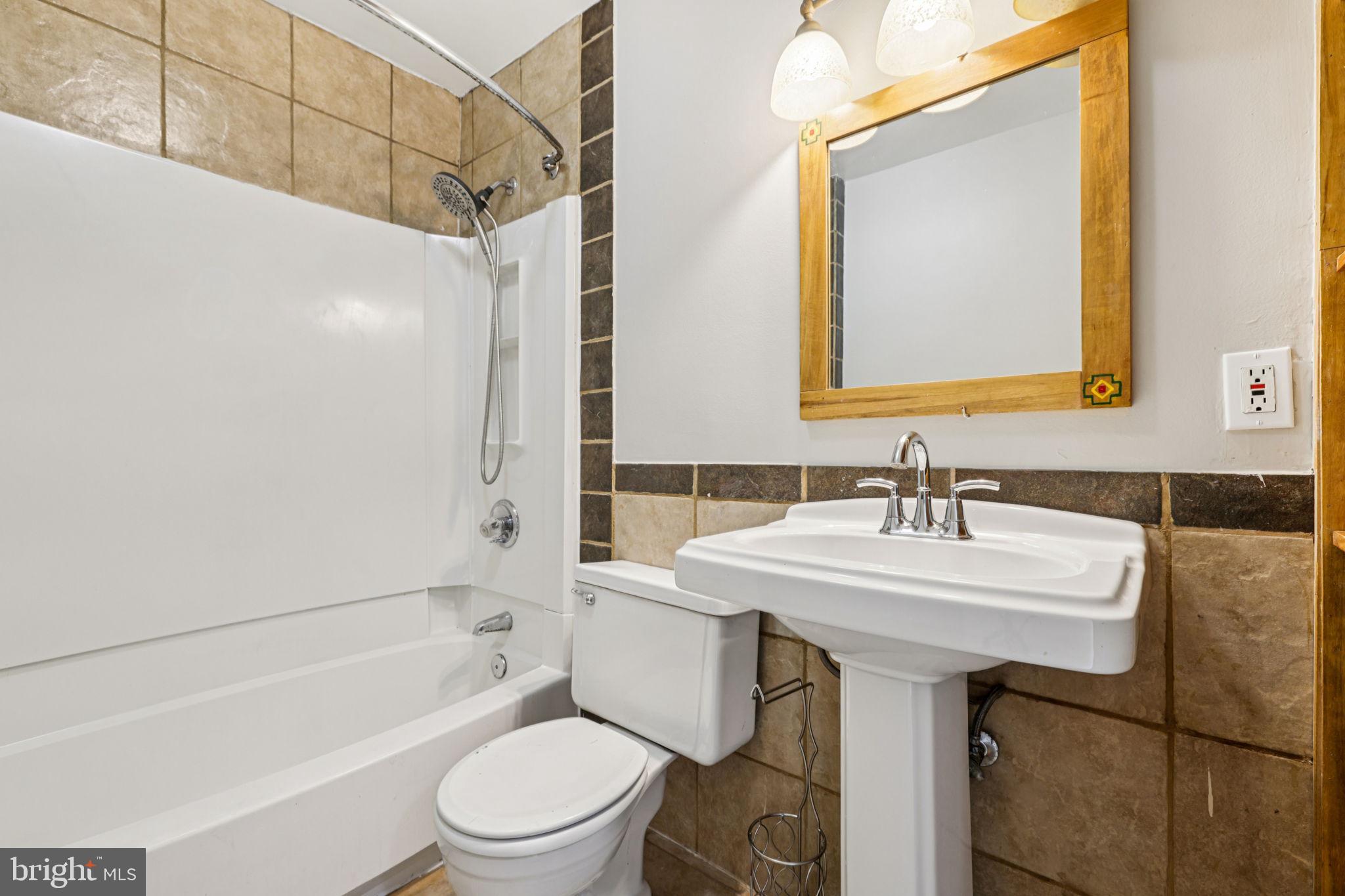 19924 Wyman Way Germantown, MD 20874 - Photo 20 of 47 a bathroom with a sink toilet and shower