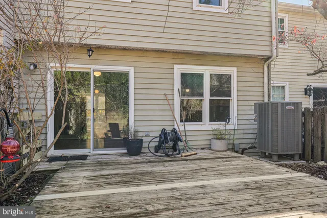 a view of a house with a bench in patio