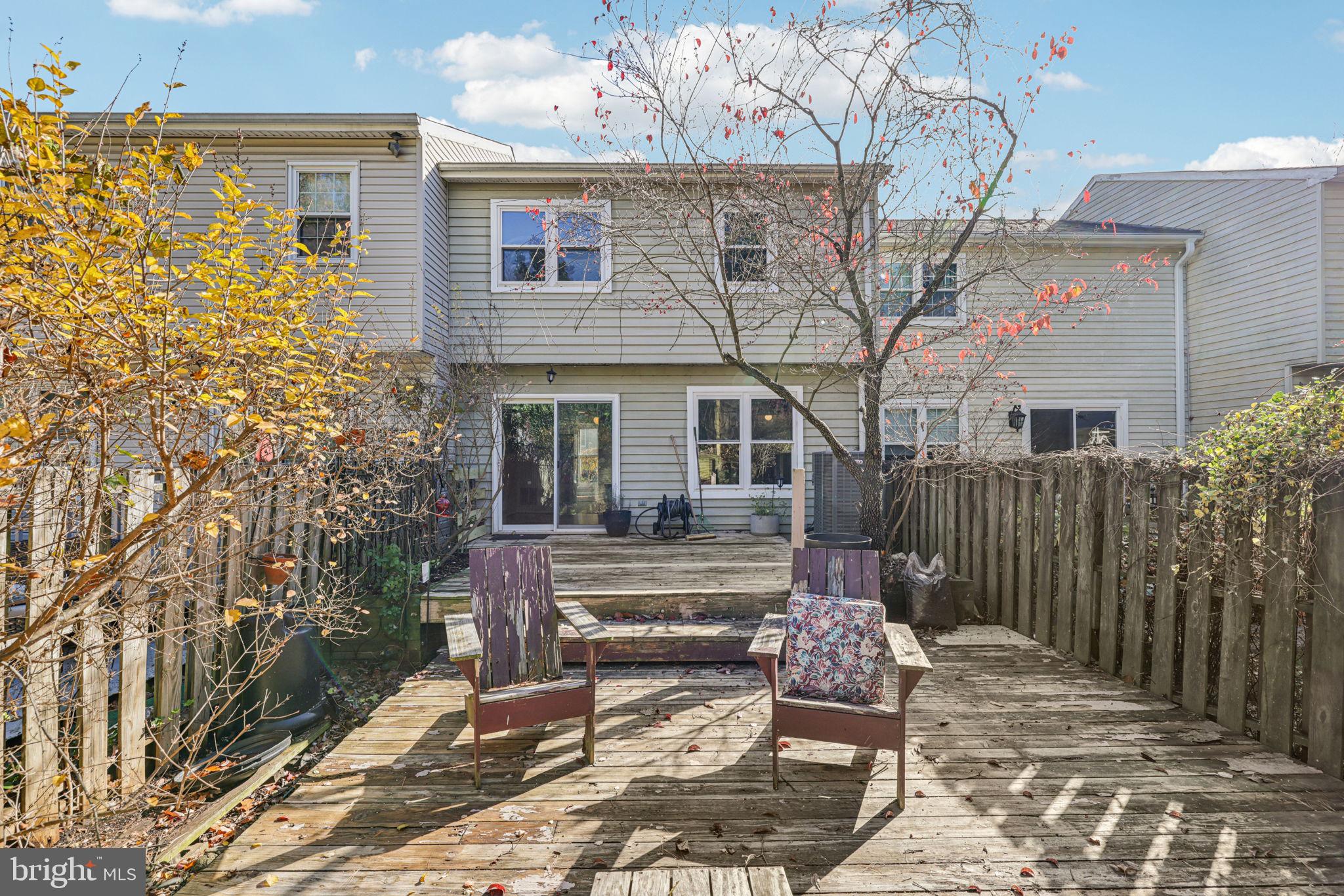 19924 Wyman Way Germantown, MD 20874 - Photo 30 of 47 a view of a house with a bench in patio