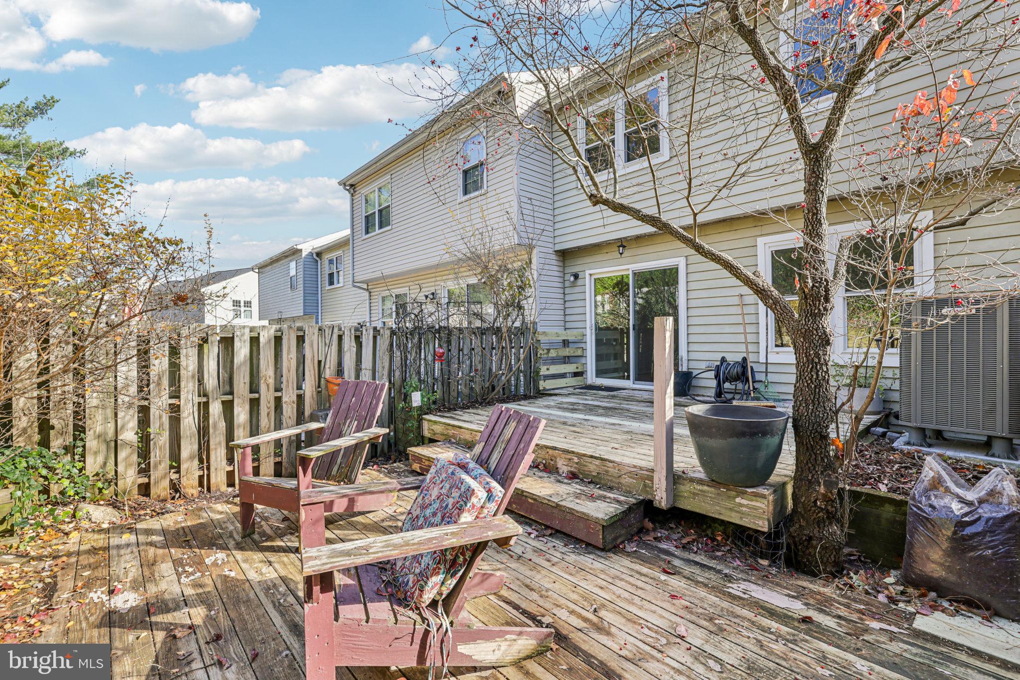 19924 Wyman Way Germantown, MD 20874 - Photo 31 of 47 a backyard of a house with barbeque oven table and chairs