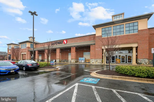 a front view of a building with parking