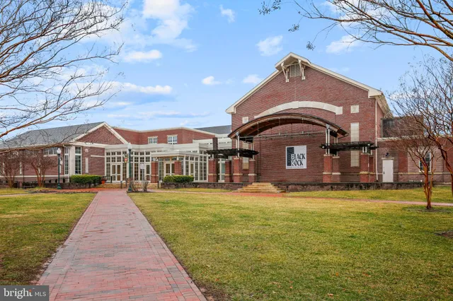 a front view of a building with retail shops