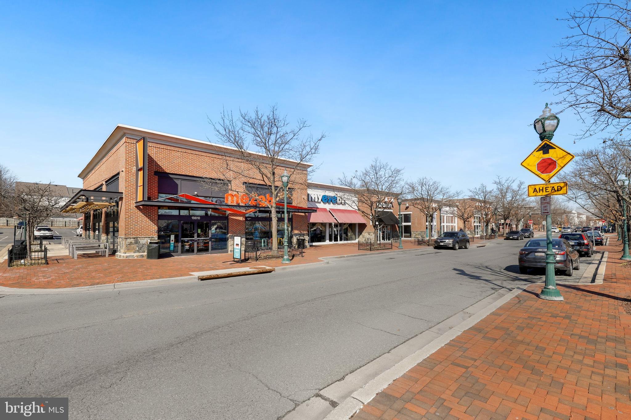 19924 Wyman Way Germantown, MD 20874 - Photo 43 of 47 a front view of a building with cars parked