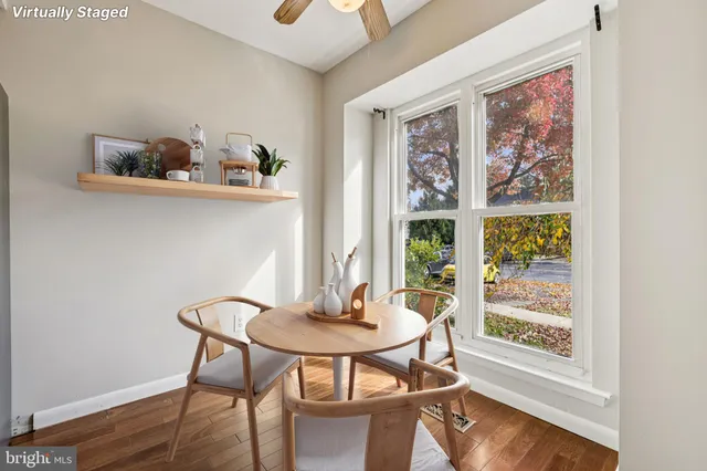 a dining room with furniture and window