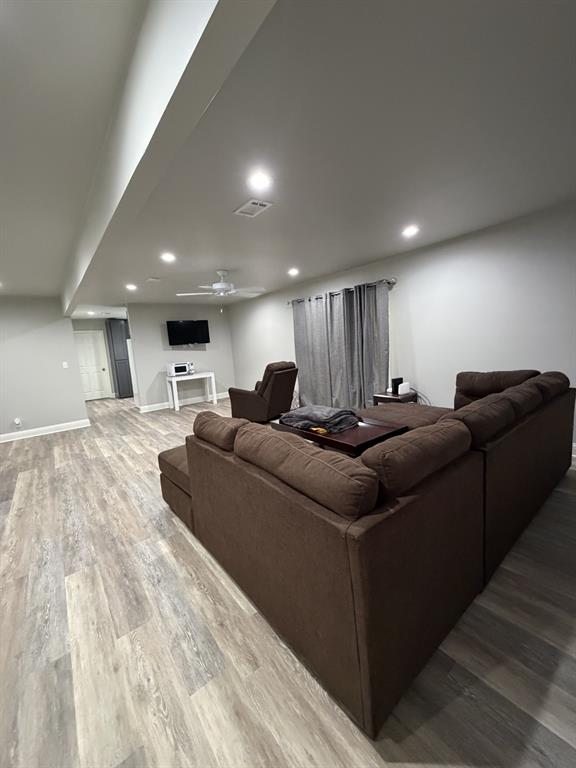118 Carolyn Street Mansfield, LA 71052 - Photo 11 of 26 a living room with furniture and a wooden floor