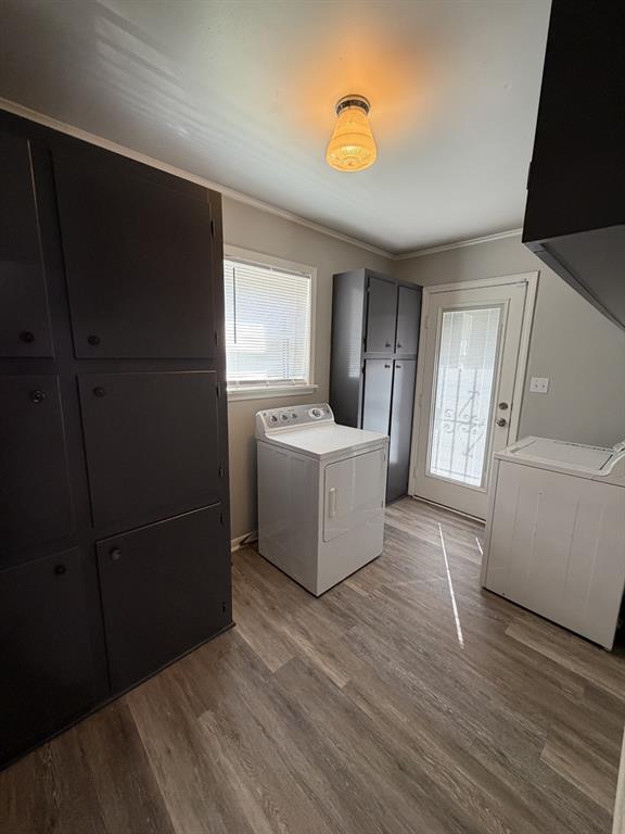 118 Carolyn Street Mansfield, LA 71052 - Photo 14 of 26 a view of a refrigerator in kitchen and an empty room with wooden floor