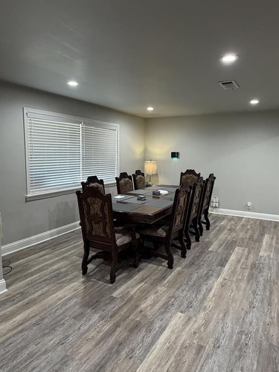118 Carolyn Street Mansfield, LA 71052 - Photo 19 of 26 a view of a dining room with furniture and wooden floor