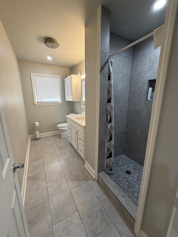 118 Carolyn Street Mansfield, LA 71052 - Photo 21 of 26 a bathroom with a glass door shower a sink and a mirror