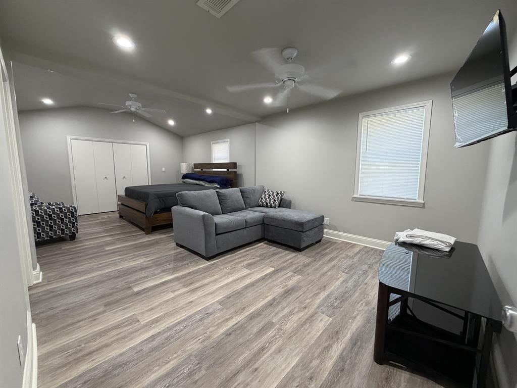 118 Carolyn Street Mansfield, LA 71052 - Photo 24 of 26 a living room with furniture and a wooden floor