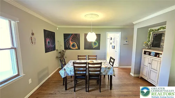 a dining room with furniture and window