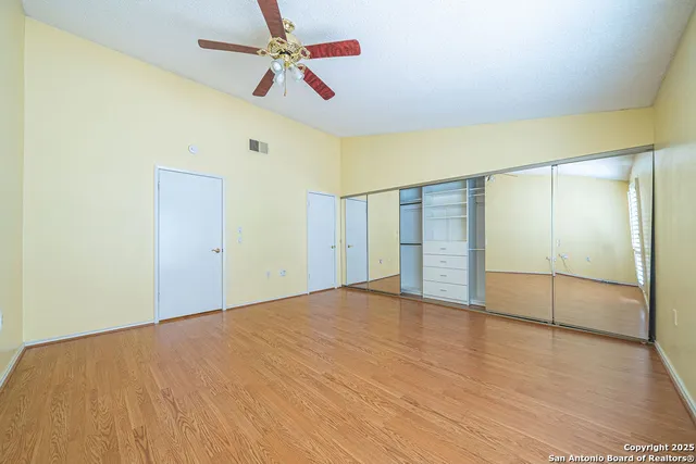 a spacious bathroom with a double vanity sink and a mirror