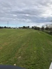 a view of field and ocean