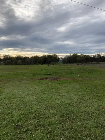 a view of an ocean and yard