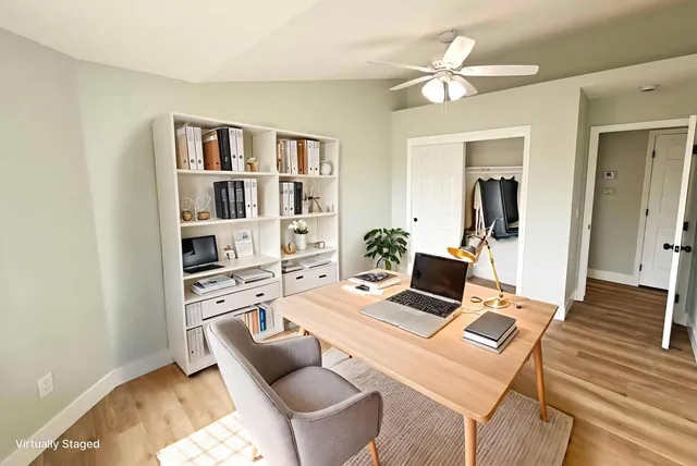 a workspace with furniture and a book shelf