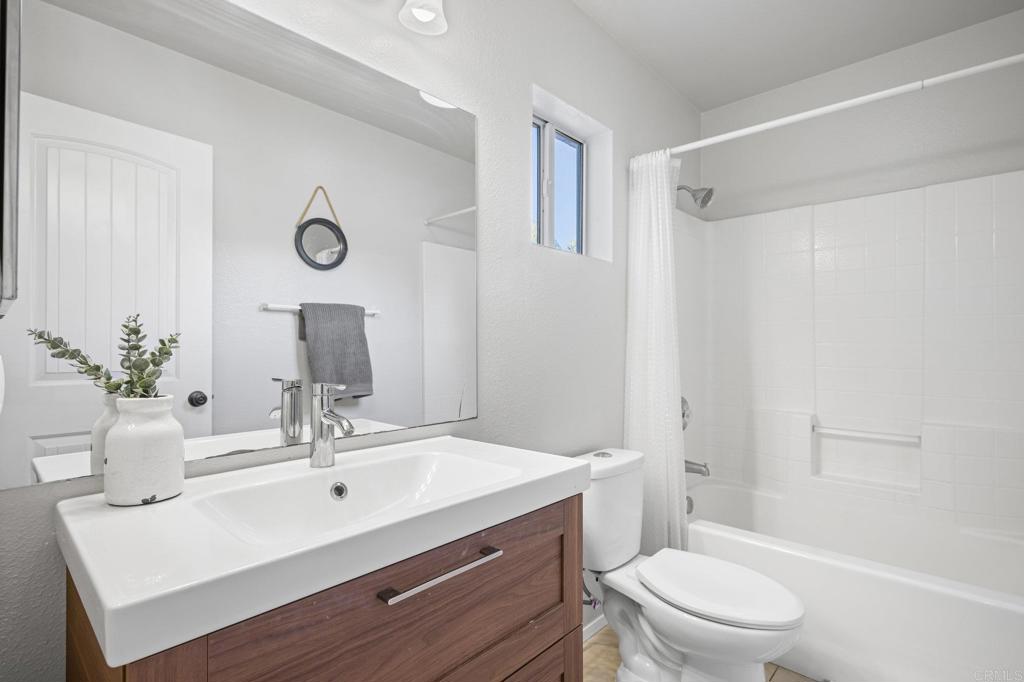 13675 Stonybrook Lane El Cajon, CA 92021 - Photo 15 of 34 a bathroom with a sink toilet and shower