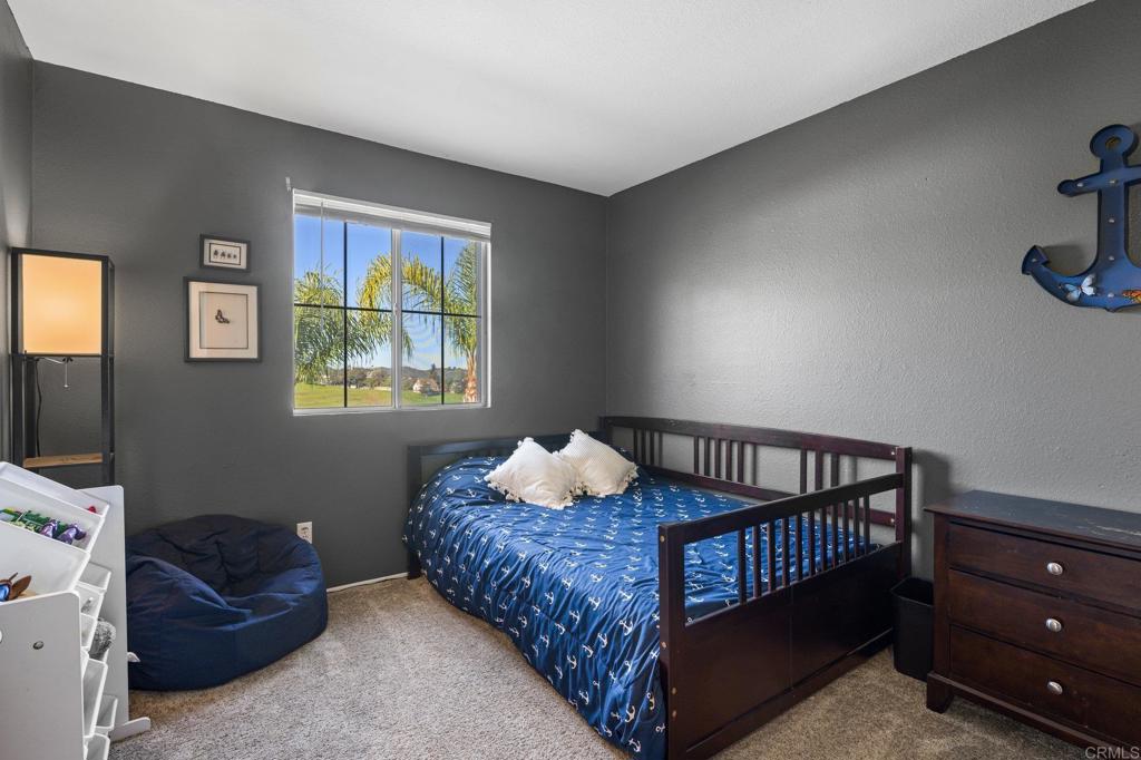 13675 Stonybrook Lane El Cajon, CA 92021 - Photo 16 of 34 a bedroom with a bed and window