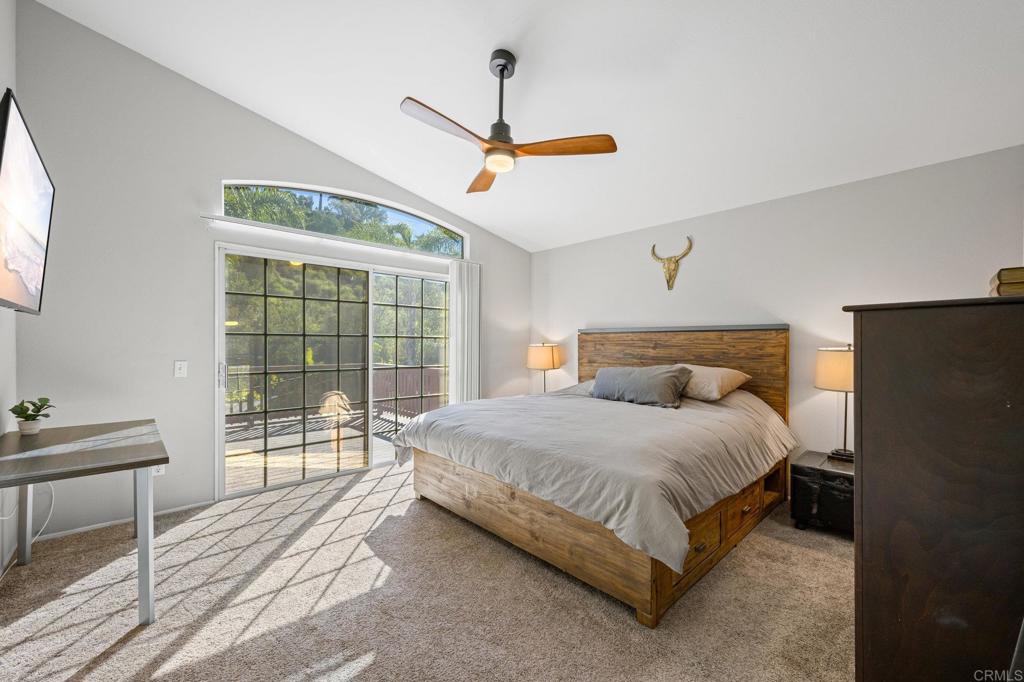 13675 Stonybrook Lane El Cajon, CA 92021 - Photo 17 of 34 a bedroom with a bed and wooden floor