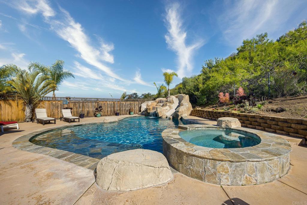 13675 Stonybrook Lane El Cajon, CA 92021 - Photo 22 of 34 a swimming pool with outdoor seating and plants