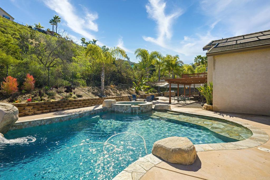 13675 Stonybrook Lane El Cajon, CA 92021 - Photo 23 of 34 a view of a swimming pool with a patio