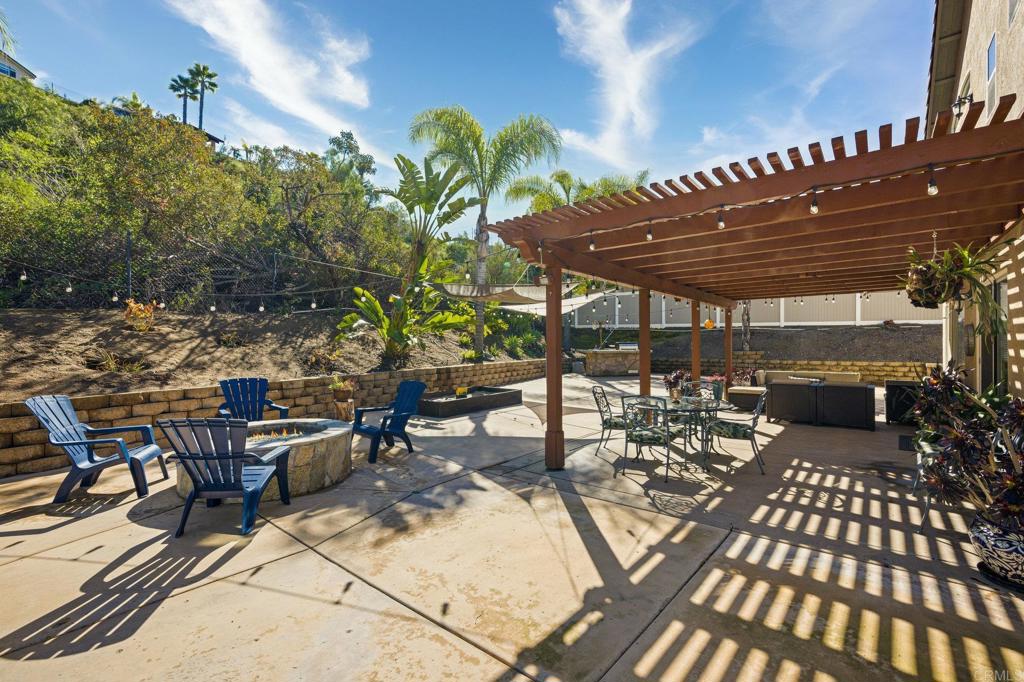 13675 Stonybrook Lane El Cajon, CA 92021 - Photo 24 of 34 a view of a patio with table and chairs and potted plants