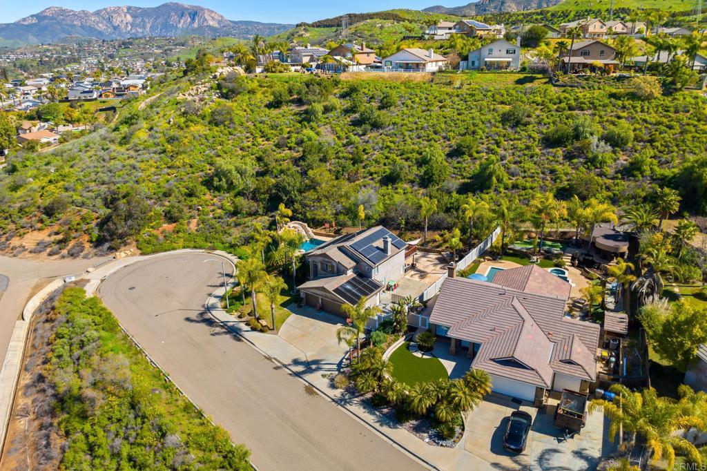 13675 Stonybrook Lane El Cajon, CA 92021 - Photo 27 of 34 an aerial view of a house with a yard and mountain
