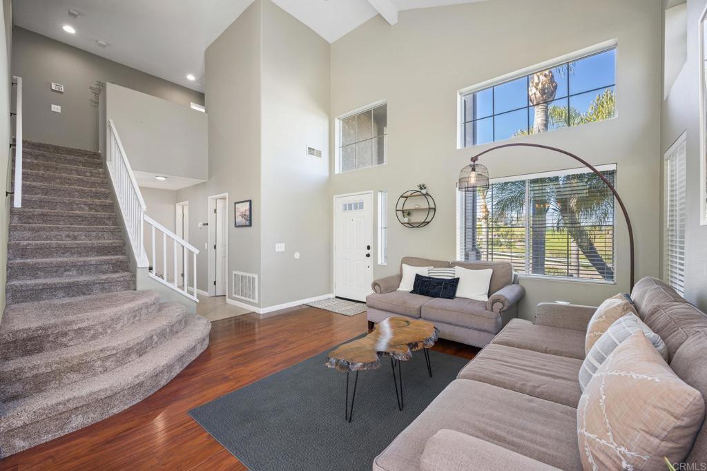 13675 Stonybrook Lane El Cajon, CA 92021 - Photo 3 of 34 a living room with furniture and a large window