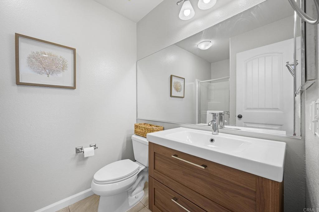 13675 Stonybrook Lane El Cajon, CA 92021 - Photo 8 of 34 a bathroom with a sink toilet and a mirror