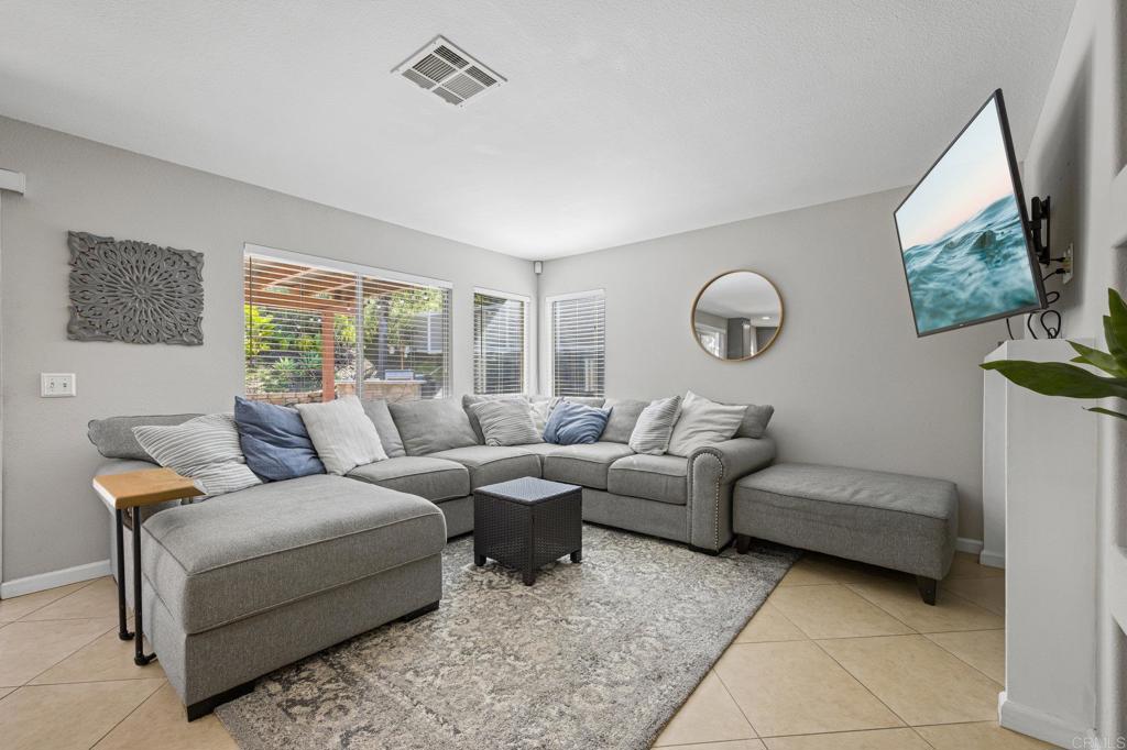 13675 Stonybrook Lane El Cajon, CA 92021 - Photo 10 of 34 a living room with furniture and a window