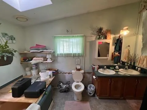 a living room with furniture and a mirror
