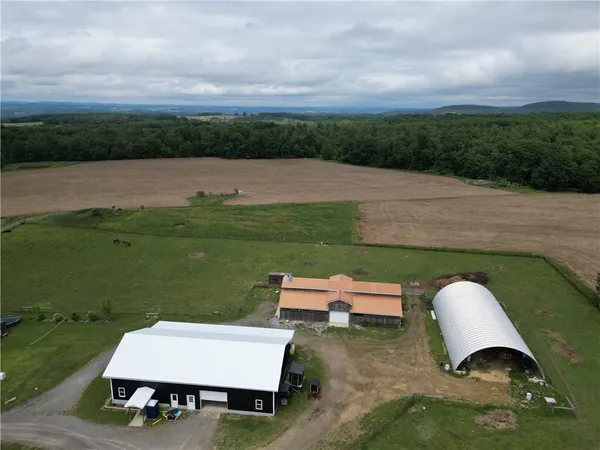 an aerial view of a house having yard