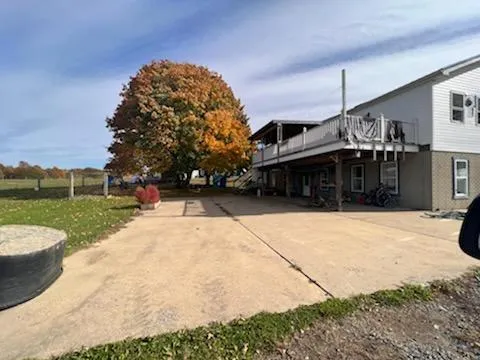 a view of a house with a yard