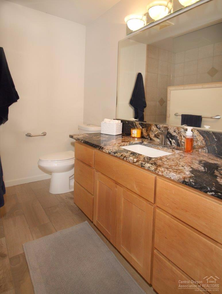 357 Southeast Soft Tail Loop Bend, OR 97702 - Photo 19 of 23 Main guest bath upstairs has tiled walk