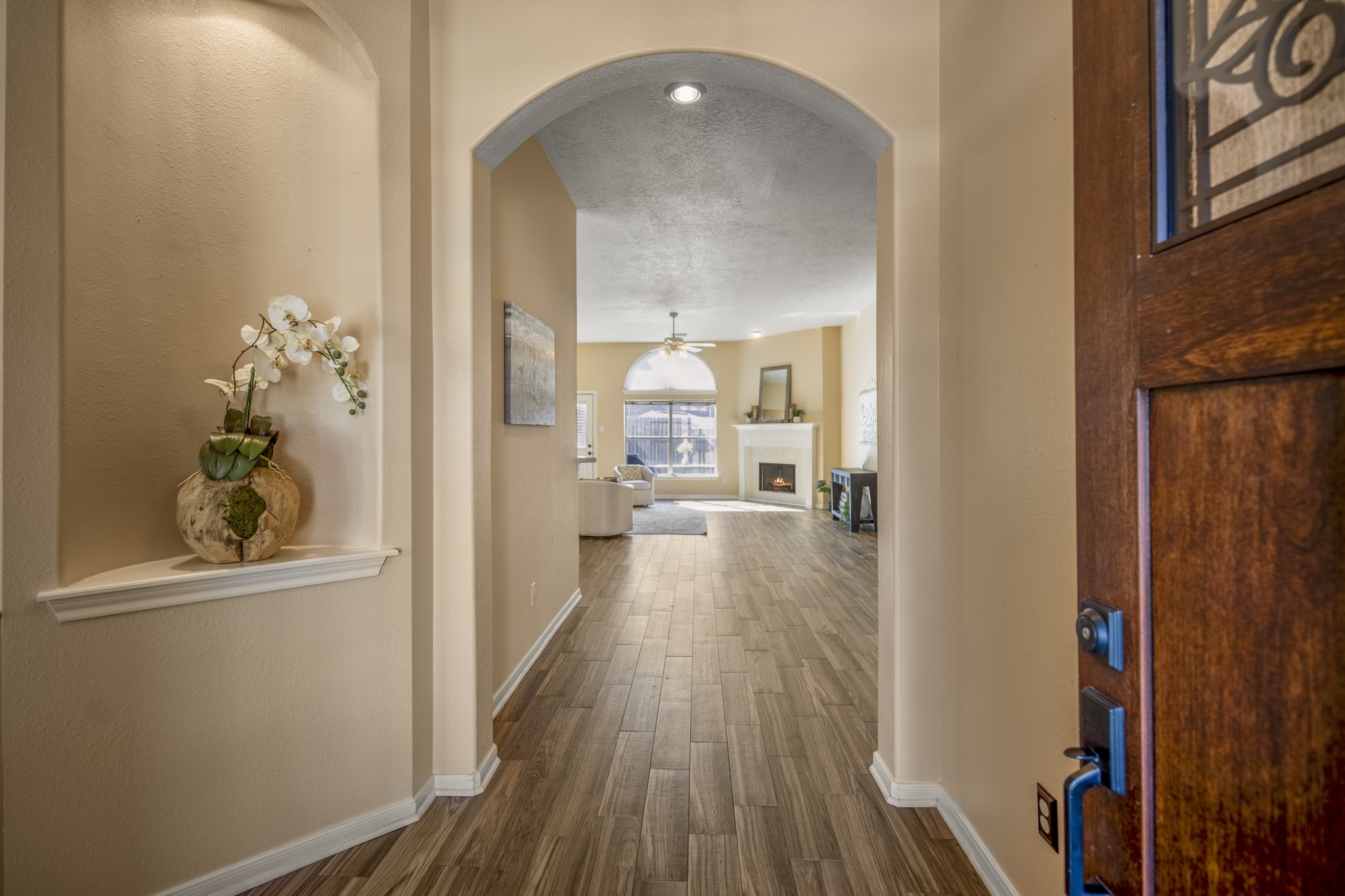 21107 Coldde Meadow Lane Spring, TX 77379 - Photo 3 of 50 a view of a hallway with wooden floor and a living room