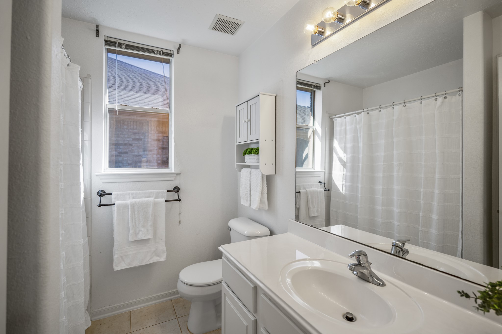 21107 Coldde Meadow Lane Spring, TX 77379 - Photo 31 of 50 a bathroom with a sink toilet and shower