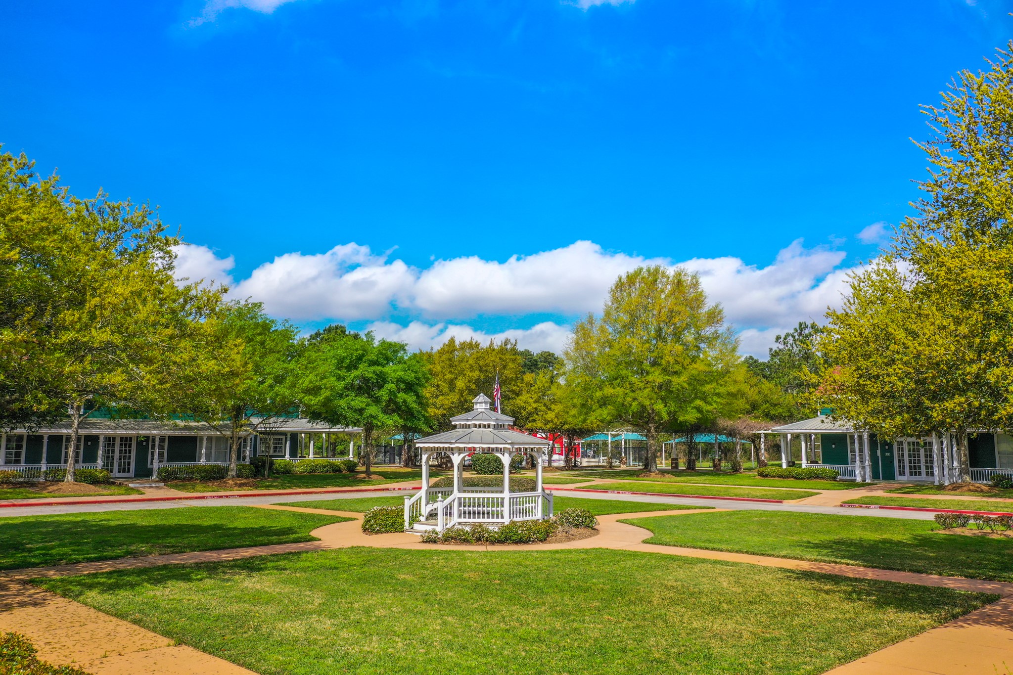 21107 Coldde Meadow Lane Spring, TX 77379 - Photo 42 of 50 This is a ground view of the clubhouses & a stunning courtyard area w/ benches and walking trails. Many students will come and take their professional photos from this beautiful and serene courtyard.