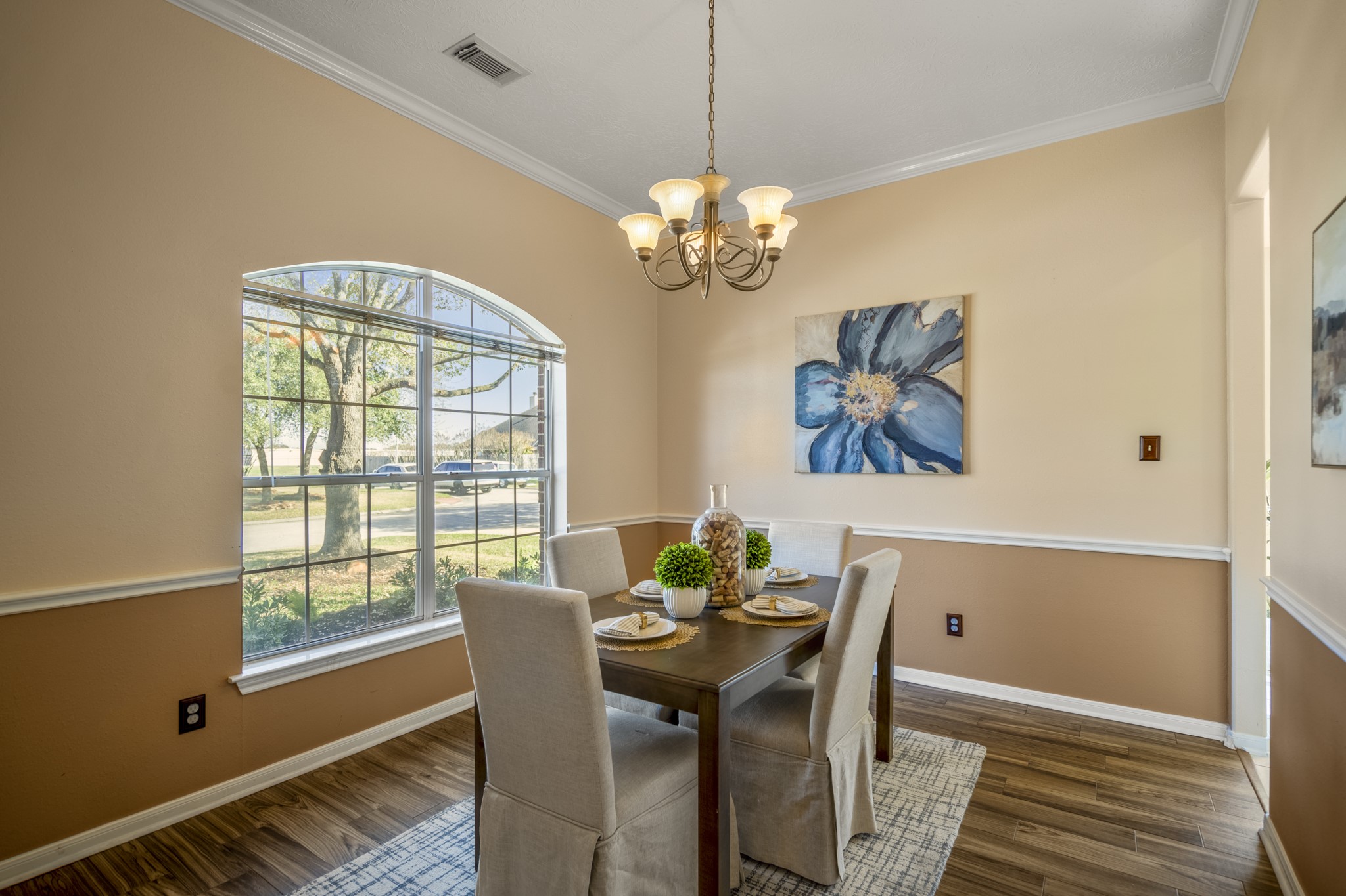 21107 Coldde Meadow Lane Spring, TX 77379 - Photo 5 of 50 a view of a dining room with furniture a chandelier and wooden floor