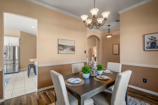 a living room with furniture a table and a fireplace