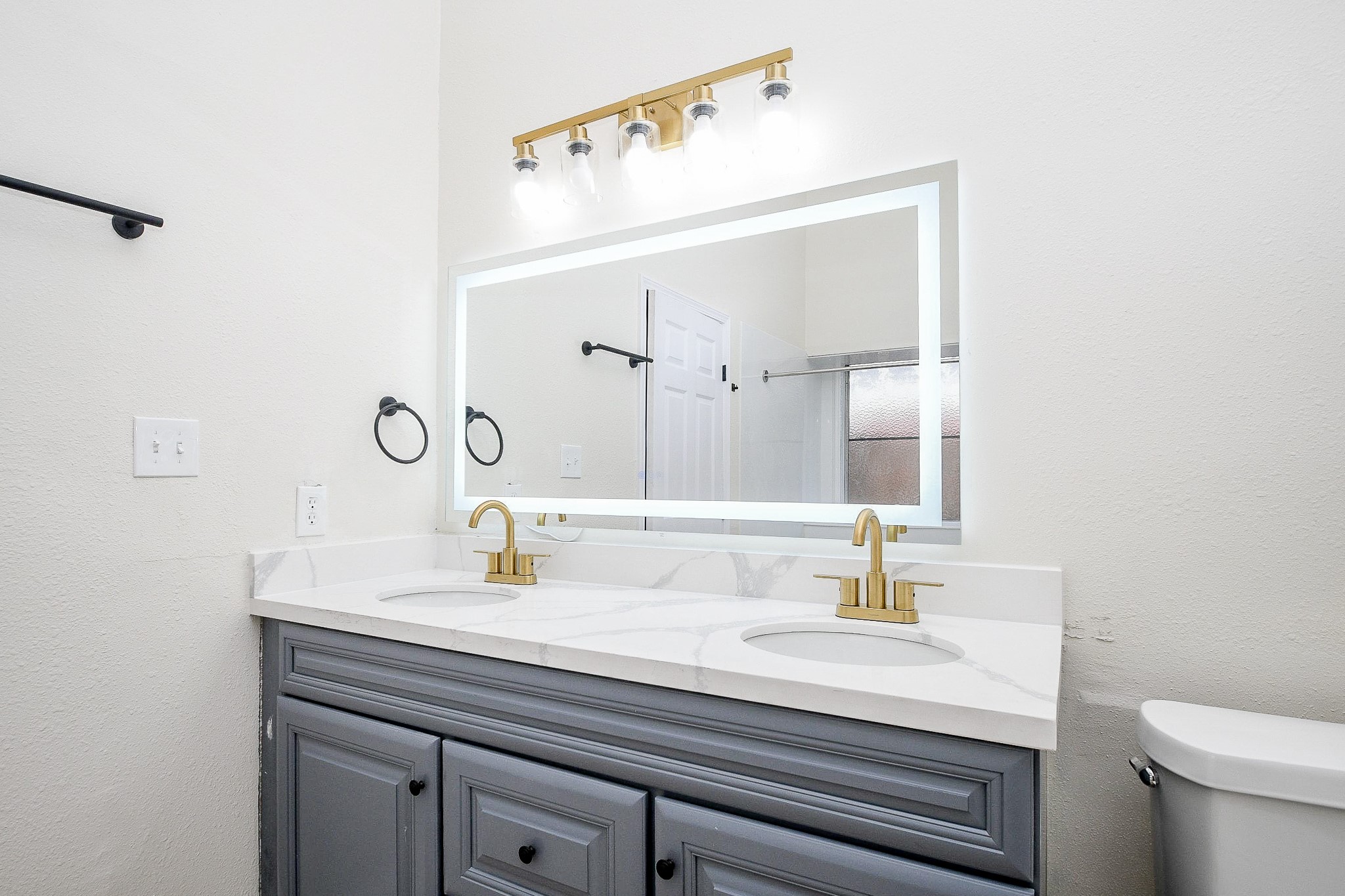 1224 Sagebrush Street Angleton, TX 77515 - Photo 4 of 20 Primary bathroom double sinks and lovely lighted mirror