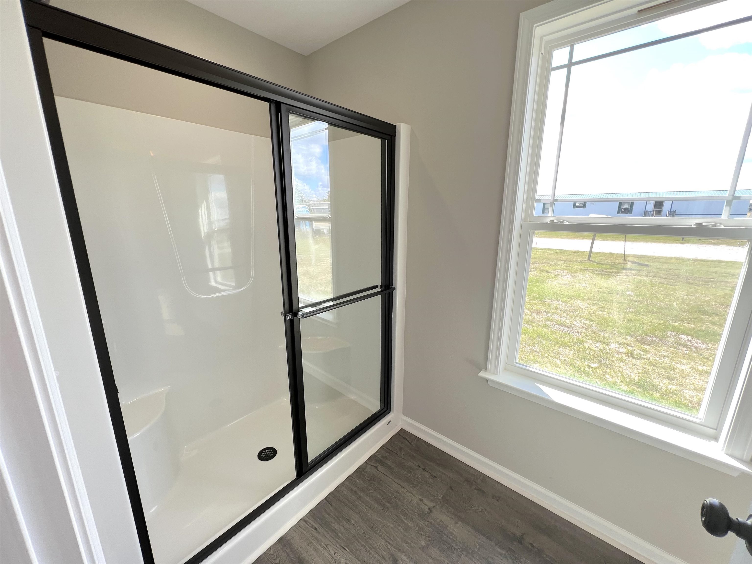 111 Adds Road Pikeville, NC 27863 - Photo 16 of 23 a view of empty room with wooden floor and fan