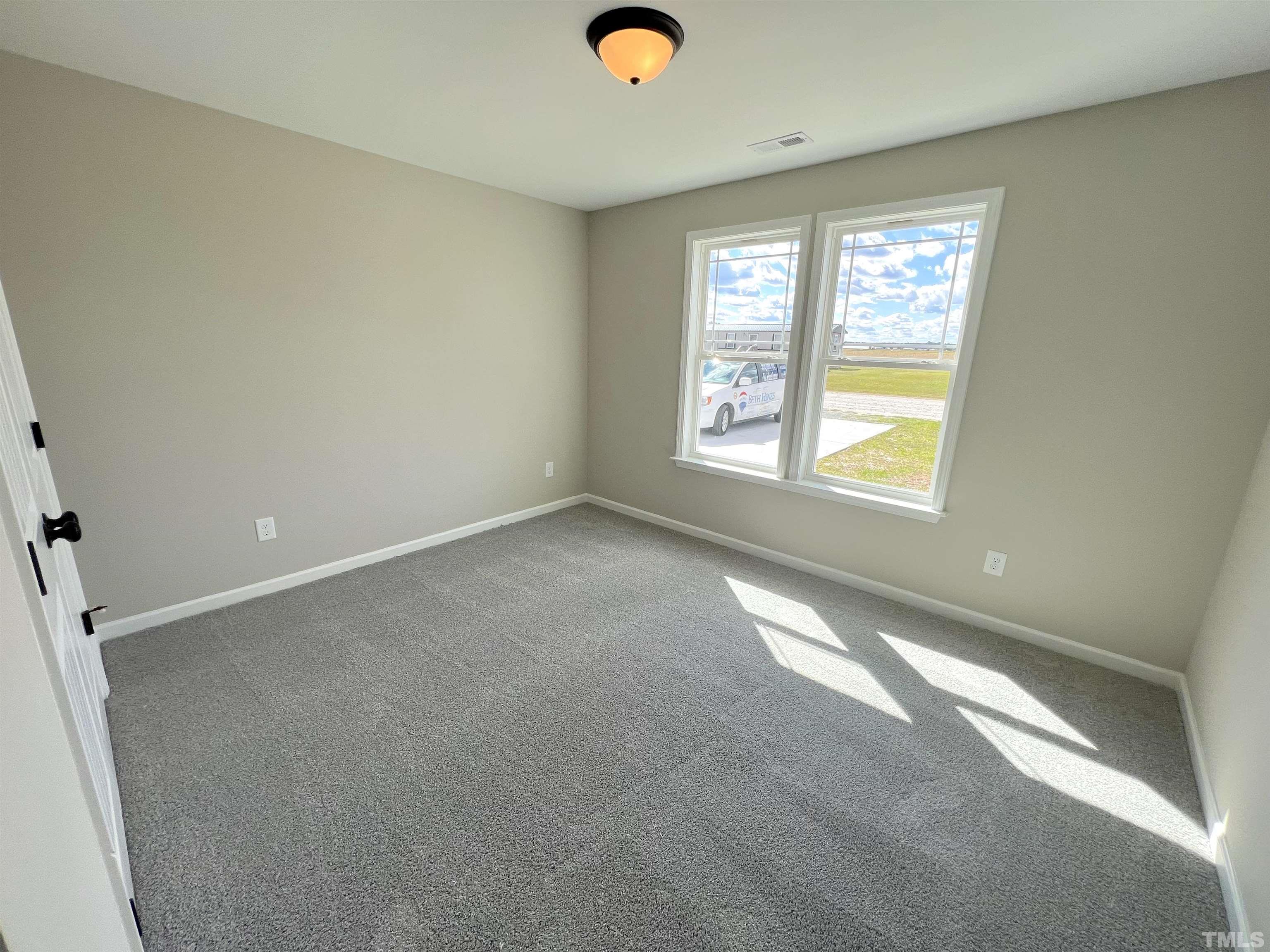 111 Adds Road Pikeville, NC 27863 - Photo 19 of 23 an empty room with windows and yard